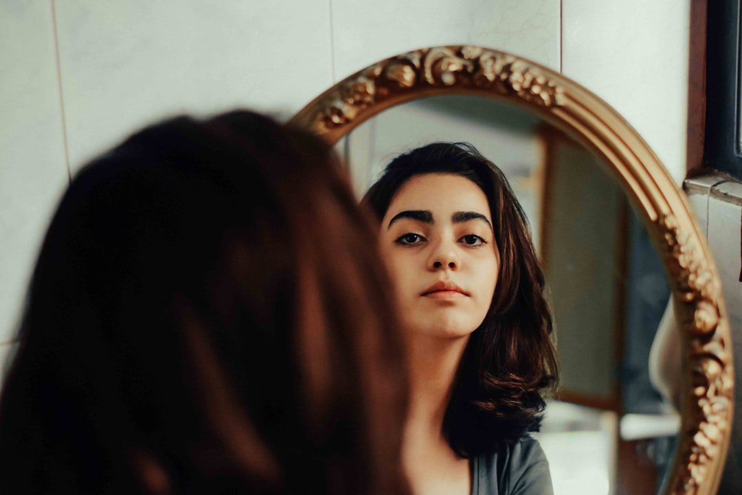 woman looking mirror confident