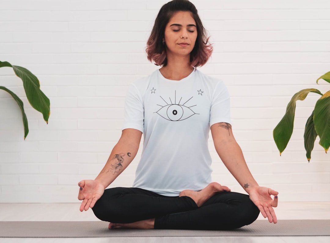 person meditating sitting upright
