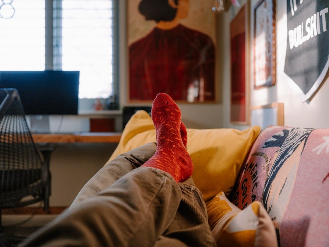 person relaxing on couch