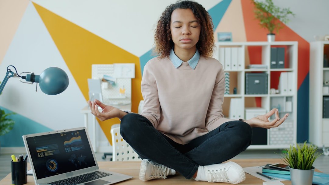 person meditation breathing desk