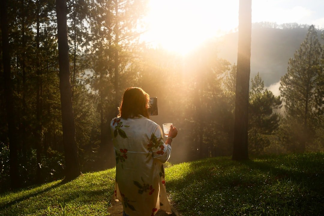 woman meditating morning sunlight
