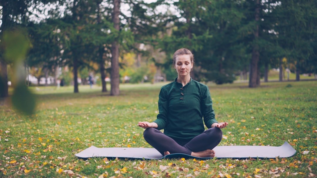 person meditating peaceful nature