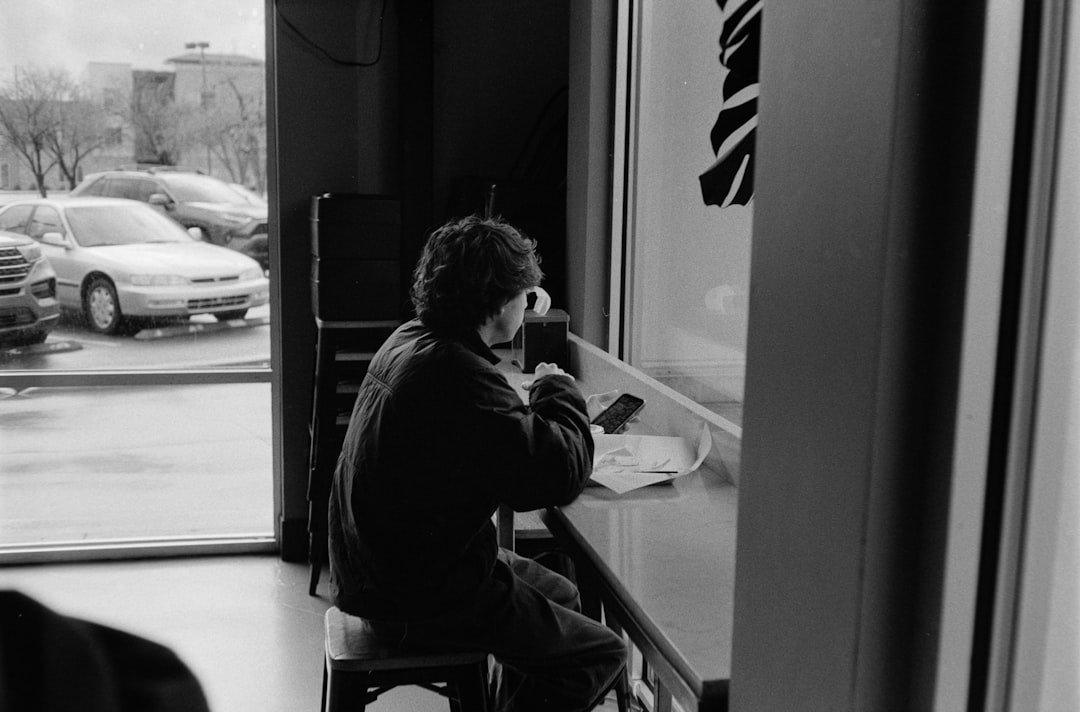person sitting alone window