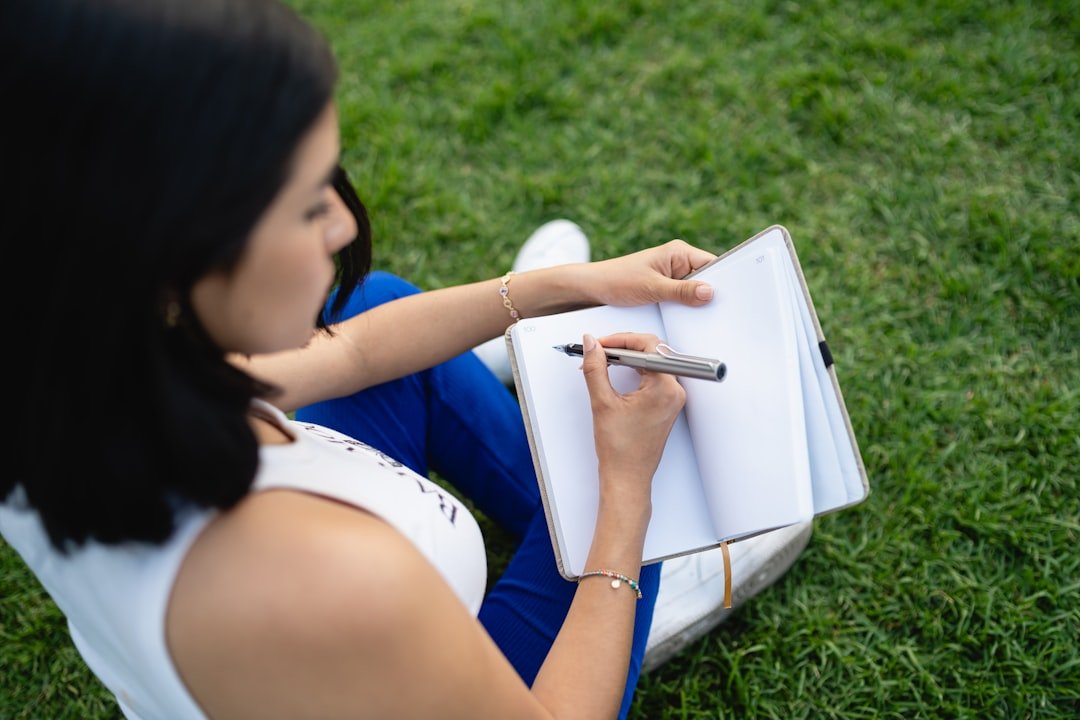 woman writing notebook growth planning