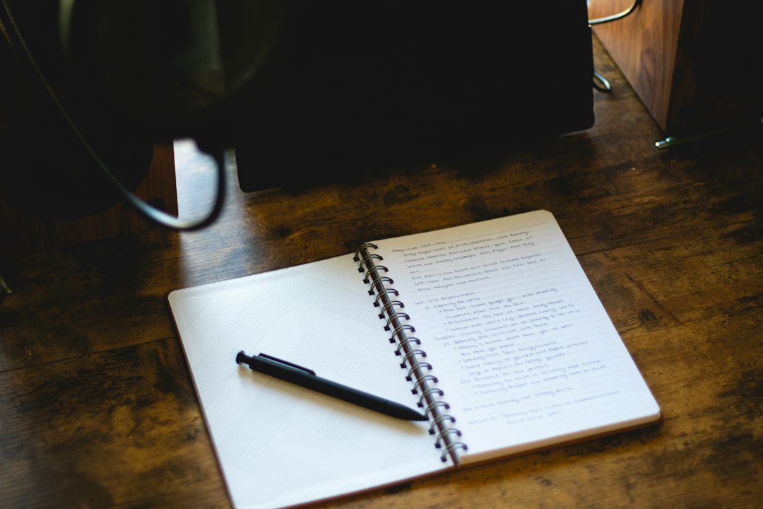 open journal pen wooden desk